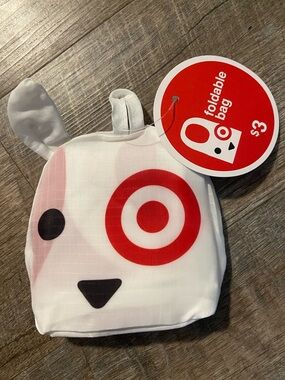 Target Dog Foldable Tote Bag - White, Red, Black and a green stuff dinosaur